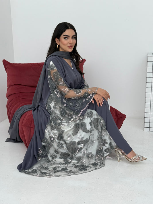 A dark grey abaya, made of premium dantel (lace) and nida fabric, this abaya is perfect for Eid and parties.