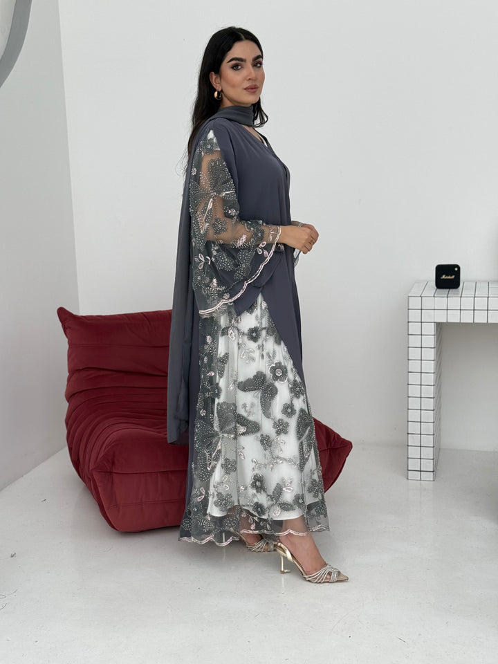 A dark grey abaya, made of premium dantel (lace) and nida fabric, this abaya is perfect for Eid and parties.