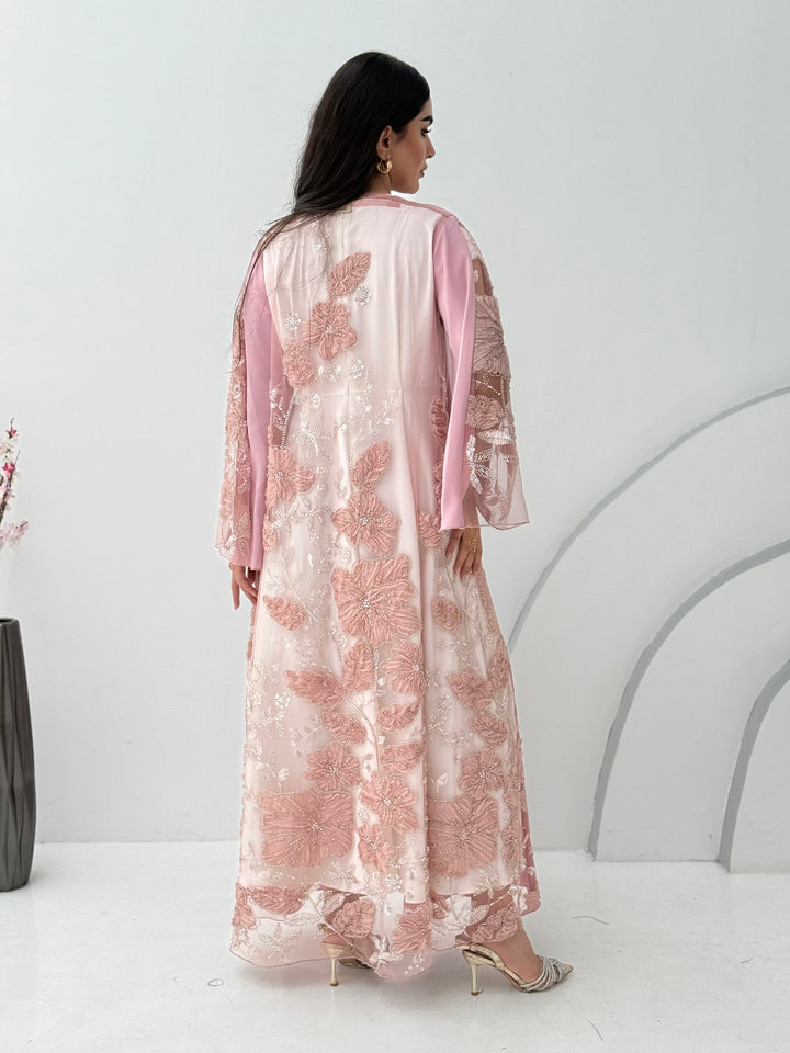 A baby pink abaya, this luxurious piece is made of lace/dantel with a premium Nida fabric, this abaya is perfect for engagement and daytime weddings.