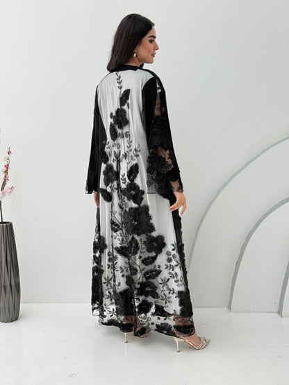 A black abaya, this luxurious piece is made of lace/dantel with a premium Nida fabric, this abaya is perfect for engagement and daytime weddings.