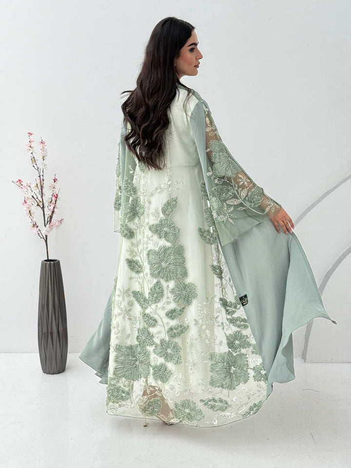 A mint green abaya, this luxurious piece is made of lace/dantel with a premium Nida fabric, this abaya is perfect for engagement and daytime weddings.