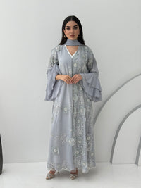 A luxurious light grey abaya with chiffon and texture of Black floral lace. This abaya is perfect for evening outings and occasions.