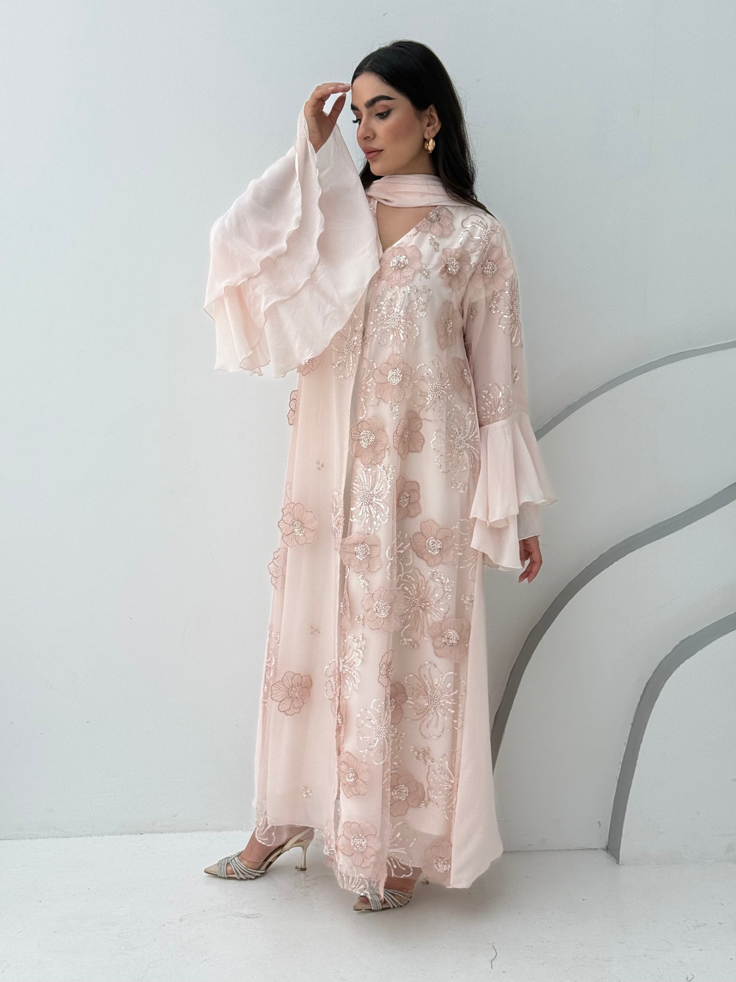 A luxurious light pink abaya with chiffon and texture of Black floral lace. This abaya is perfect for evening outings and occasions.