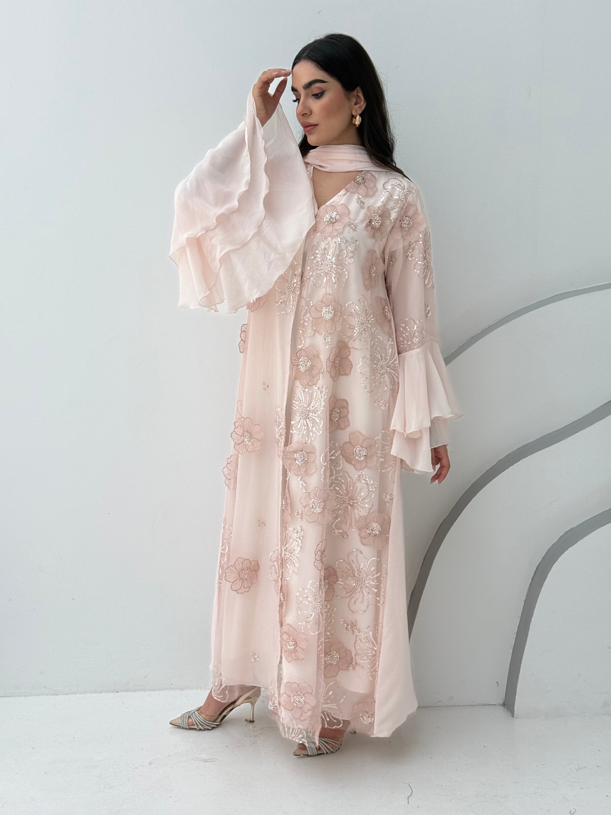 A luxurious light pink abaya with chiffon and texture of Black floral lace. This abaya is perfect for evening outings and occasions.