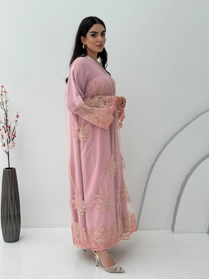 A dusty pink embroidery nida abaya, a very comfortable abaya for gatherings.