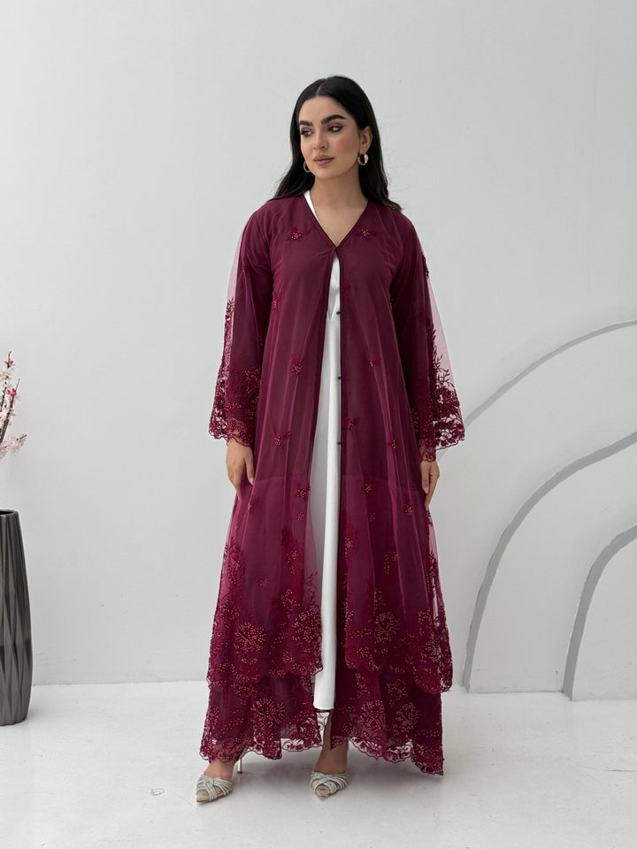 A stunning chiffon maroon abaya, that features floral lace on the sleeves. Its perfect for weddings or heena, daytime occasions and for formal events.
