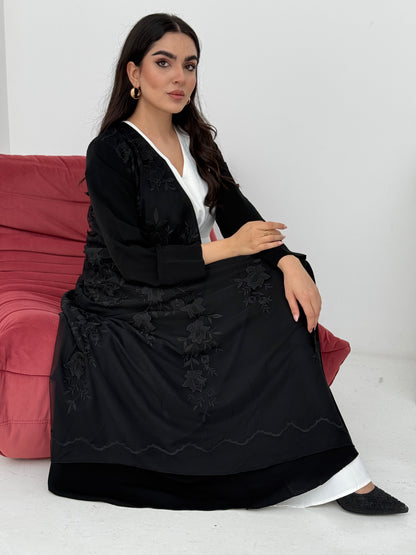 A luxury premium black abaya, the abaya is made of nida fabric with lace designs. Perfect for formal events.