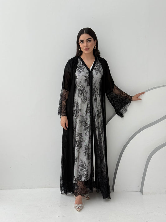 A black abaya of chiffon material with lace overlay, This abaya is perfect for Eid, dinner outings, and parties.