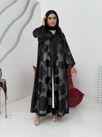 A black floral abaya crafted from organza and lace fabric. Perfect choice for events.