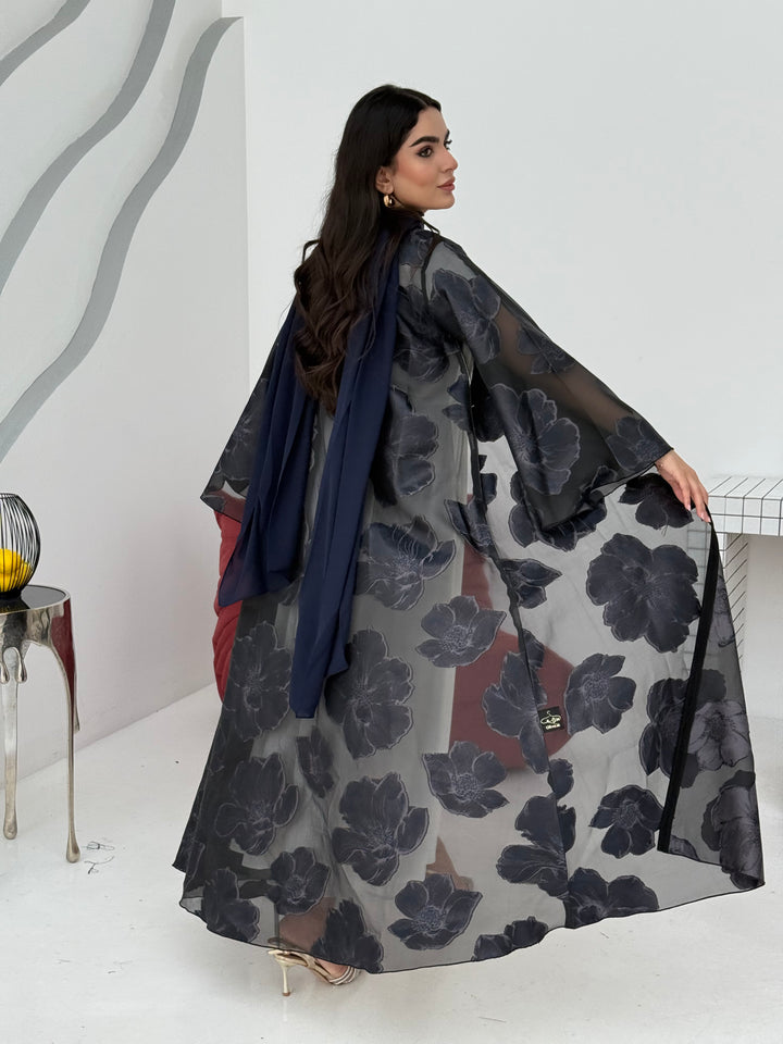 A navy blue floral abaya crafted from organza and lace fabric. Perfect choice for events.