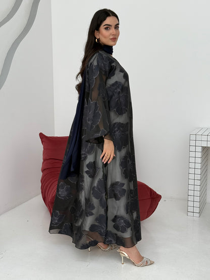 A navy blue floral abaya crafted from organza and lace fabric. Perfect choice for events.