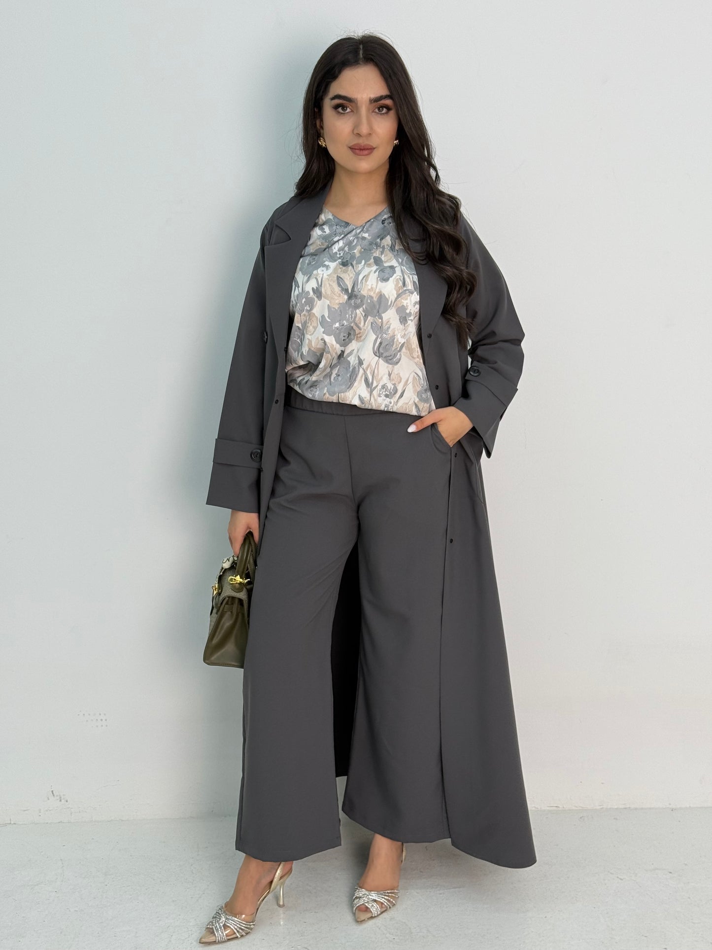 A grey abaya set that includes coat abaya, matching pants, printed top and sheila. This set if perfect for formal events, office wear and university,