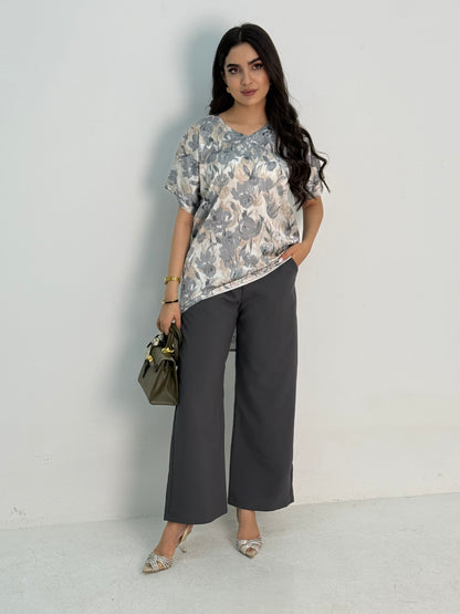 A grey abaya set that includes coat abaya, matching pants, printed top and sheila. This set if perfect for formal events, office wear and university,