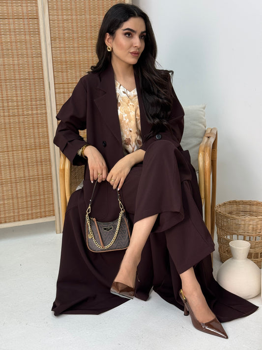 A dark brown abaya set that includes a coat abaya, matching pants, printed top, and sheila. This set is perfect for formal events, office wear, and university.