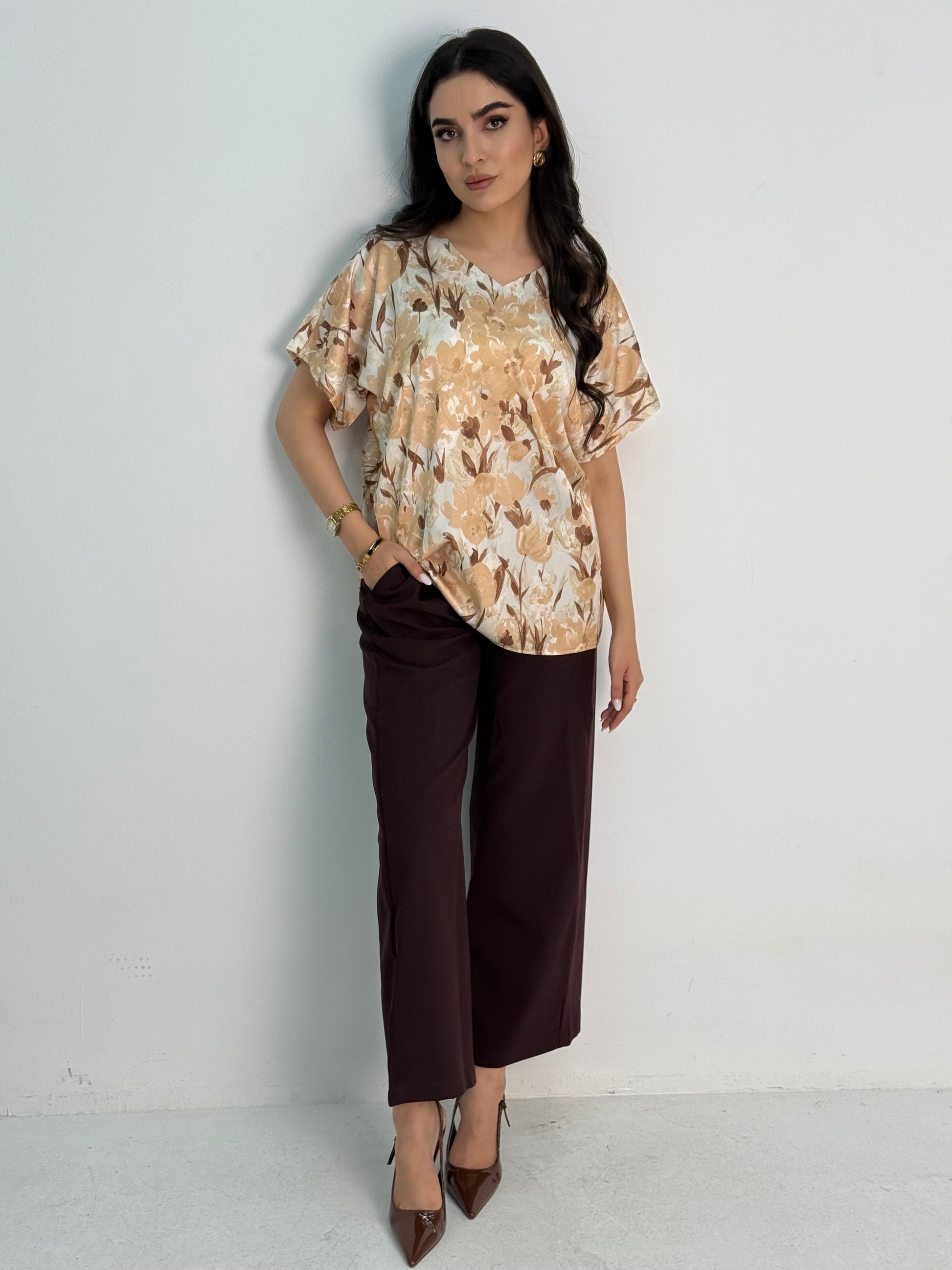 A dark brown abaya set that includes a coat abaya, matching pants, printed top, and sheila. This set is perfect for formal events, office wear, and university.