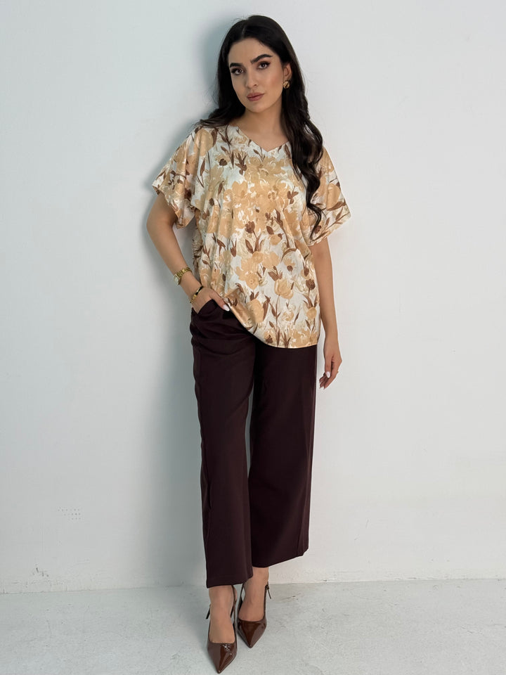 A dark brown abaya set that includes a coat abaya, matching pants, printed top, and sheila. This set is perfect for formal events, office wear, and university.