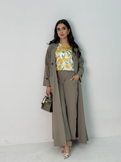 A sage green abaya set that includes a coat abaya, matching pants, printed top, and sheila. This set is perfect for formal events, office wear, and university.