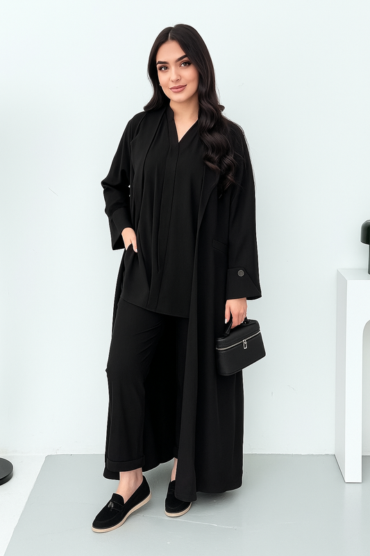 A set of black abaya that includes matching trousers, coat abaya, inner top and sheila. This abaya set is perfect for travels and corporate events.