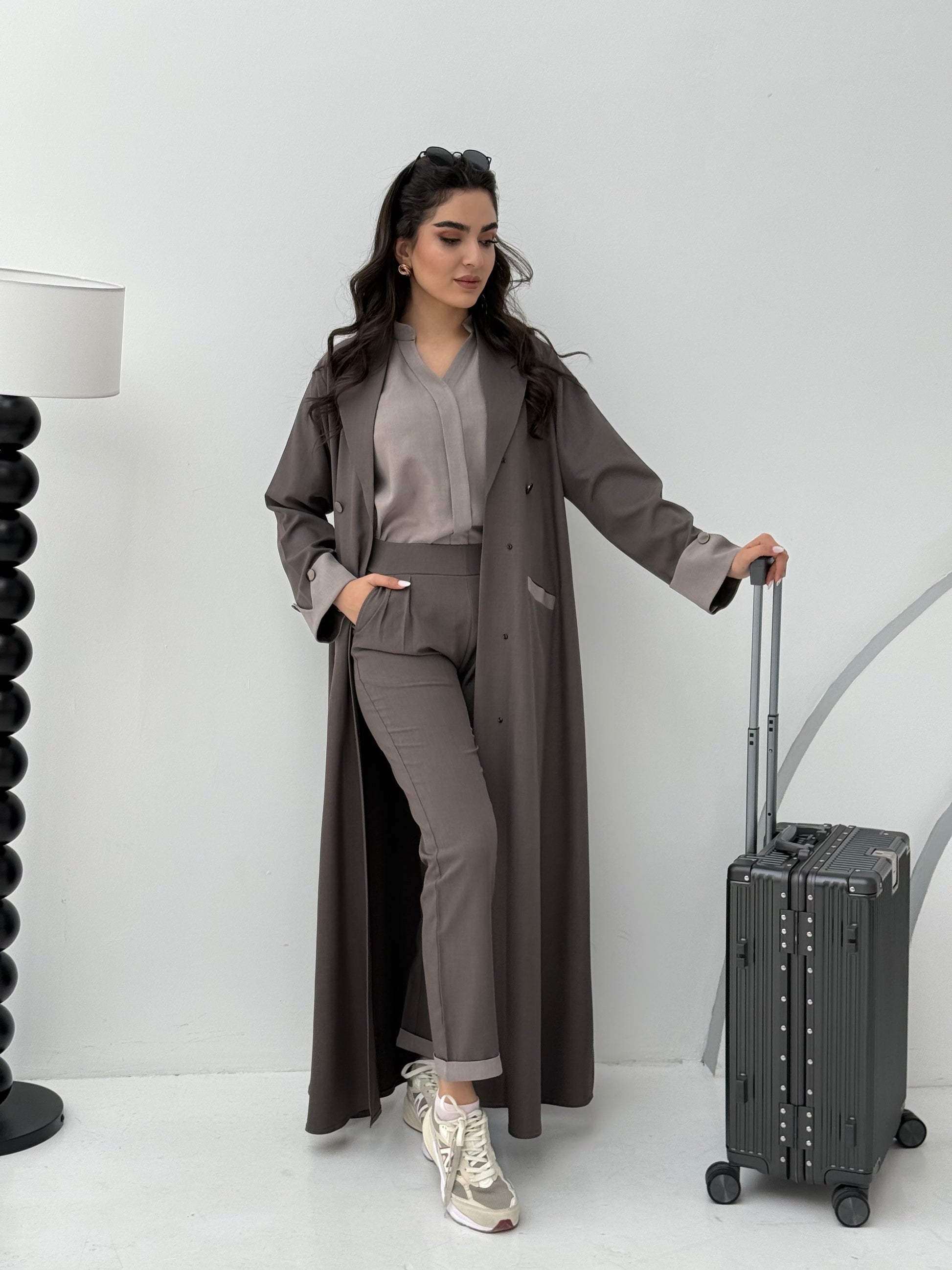 A set of brown  abaya that includes matching trousers, coat abaya, inner top and sheila. This abaya set is perfect for travels and corporate events.