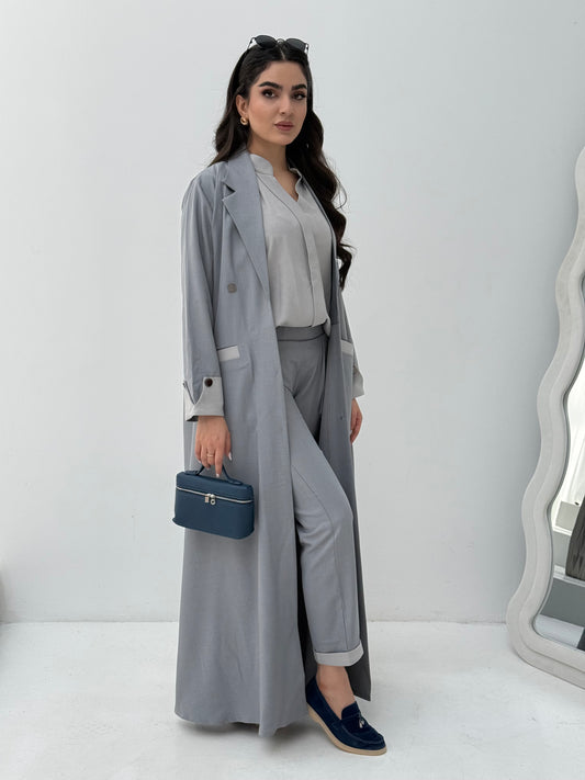 A set of grey abaya that includes matching trousers, coat abaya, inner top and sheila. This abaya set is perfect for travels and corporate events.