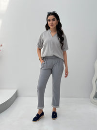 A set of grey abaya that includes matching trousers, coat abaya, inner top and sheila. This abaya set is perfect for travels and corporate events.