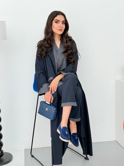 A set of navy blue abaya that includes matching trousers, coat abaya, inner top and sheila. This abaya set is perfect for travels and corporate events.