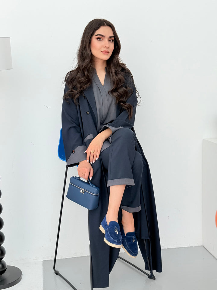 A set of navy blue abaya that includes matching trousers, coat abaya, inner top and sheila. This abaya set is perfect for travels and corporate events.
