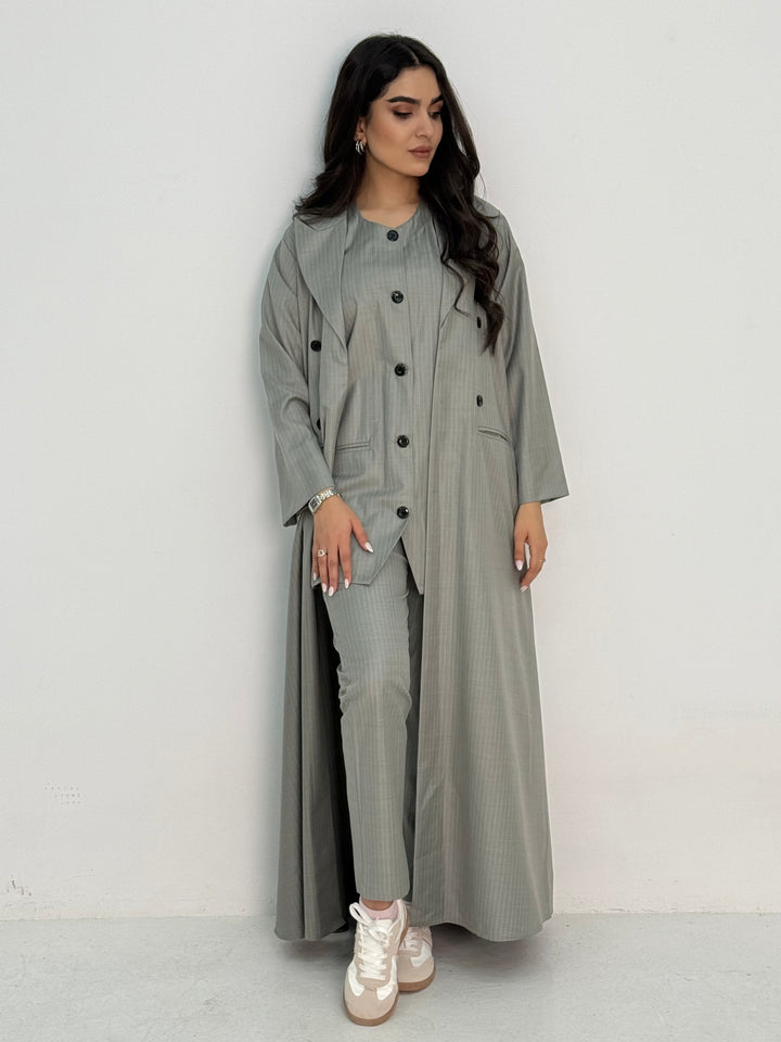 A light grey pinstripe 4 piece abaya set that includes a coat abaya, matching trouser, waistcoat top and sheila. This abaya set is perfect for daytime formal events or office wear and travel.