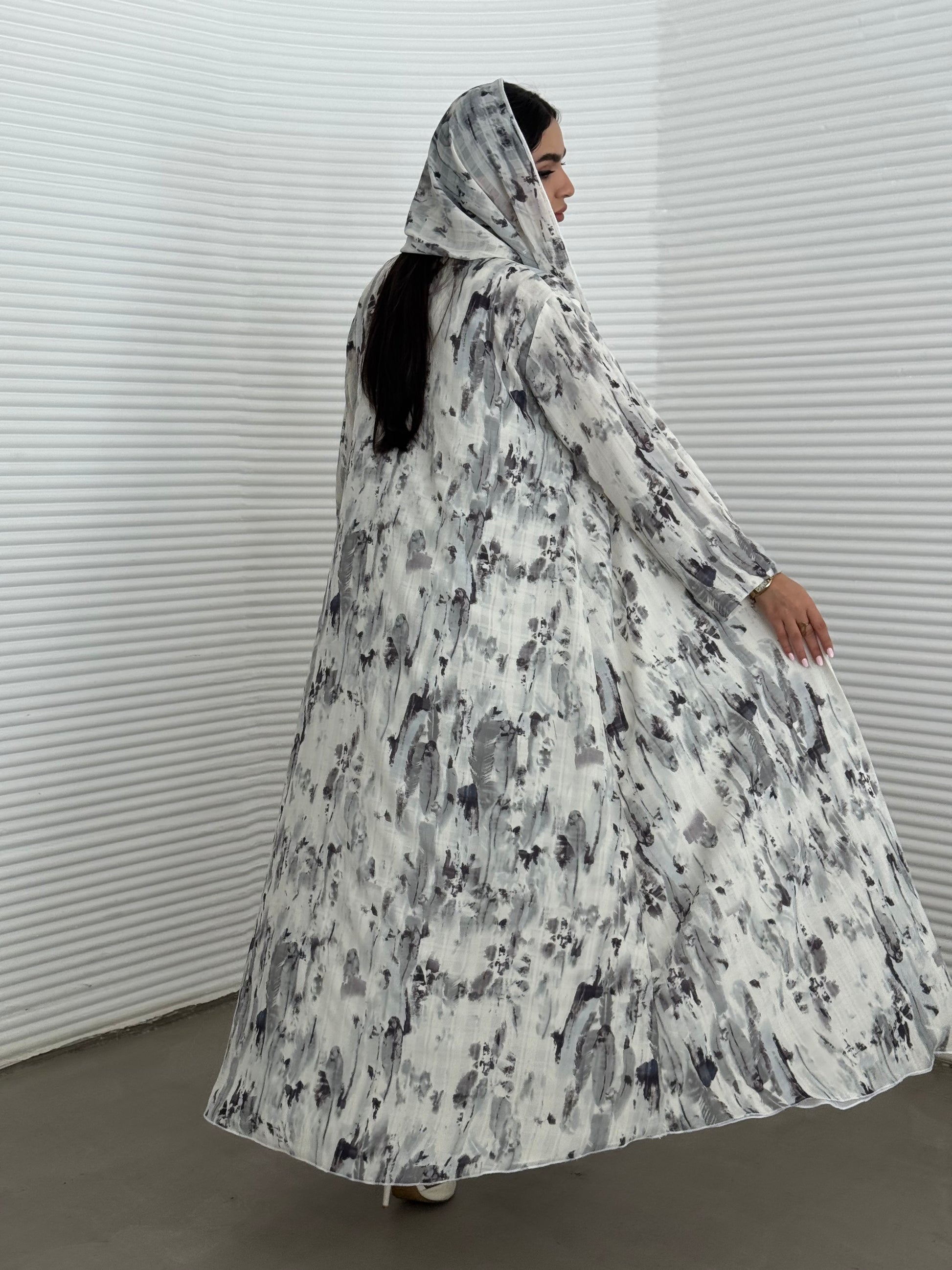 A grey printed satin abaya, an elegant abaya perfect for summer, daytime events, and artistic gatherings.