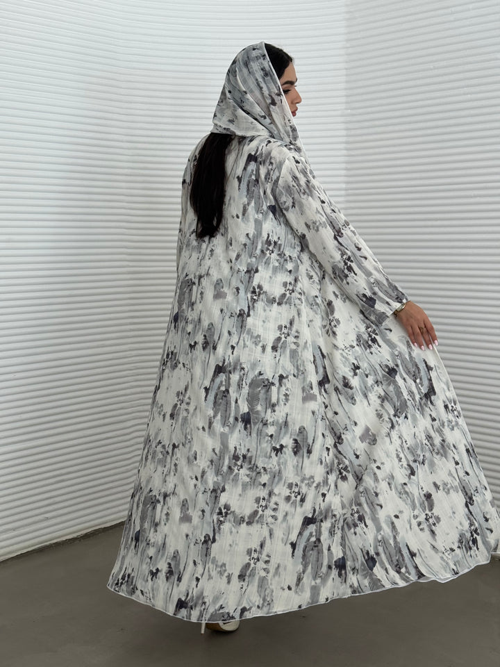A grey printed satin abaya, an elegant abaya perfect for summer, daytime events, and artistic gatherings.