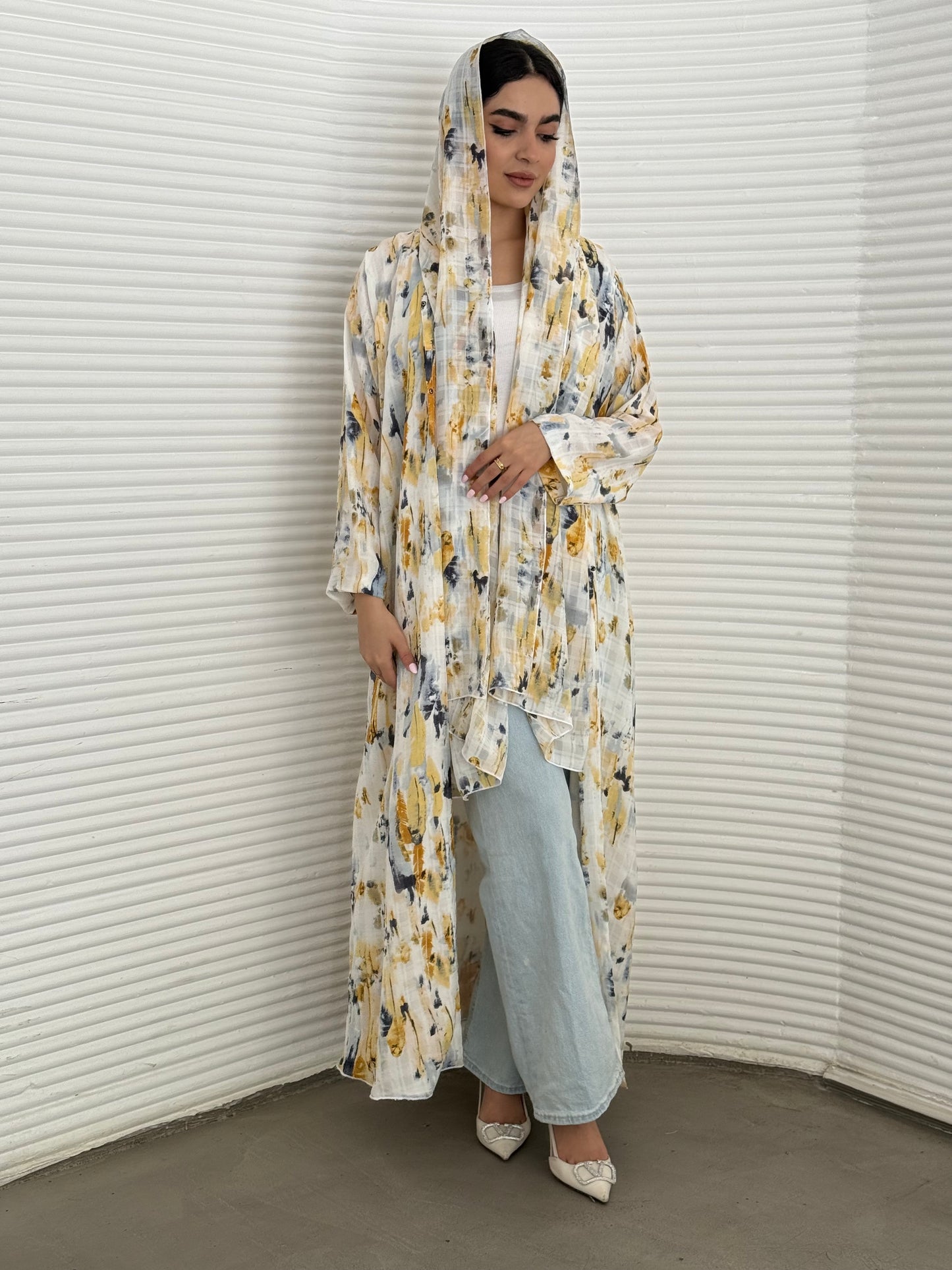 A yellow printed satin abaya, an elegant abaya that is perfect for summer, daytime events, artistic gatherings.