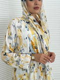 A yellow printed satin abaya, an elegant abaya that is perfect for summer, daytime events, artistic gatherings.