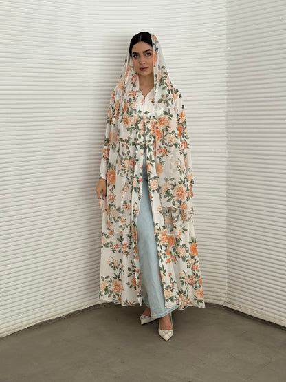 A white & orange floral chiffon abaya, an elegant abaya that is perfect for summer, daytime events, and brunch.