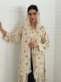 A cream minimal floral chiffon abaya, an elegant abaya that is perfect for summer, daytime events, and brunch.