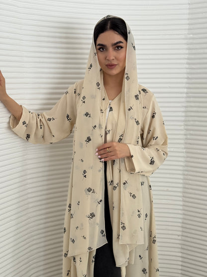A cream minimal floral chiffon abaya, an elegant abaya that is perfect for summer, daytime events, and brunch.