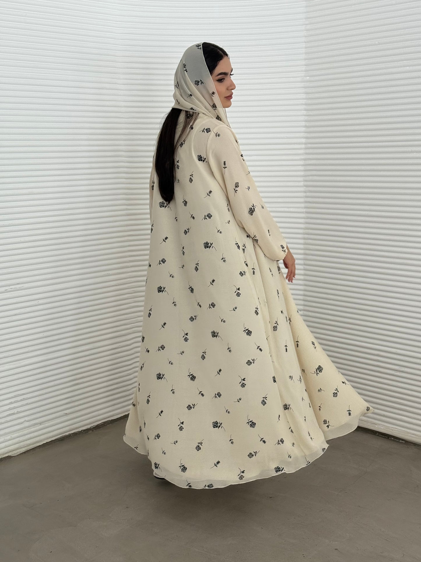 A cream minimal floral chiffon abaya, an elegant abaya that is perfect for summer, daytime events, and brunch.