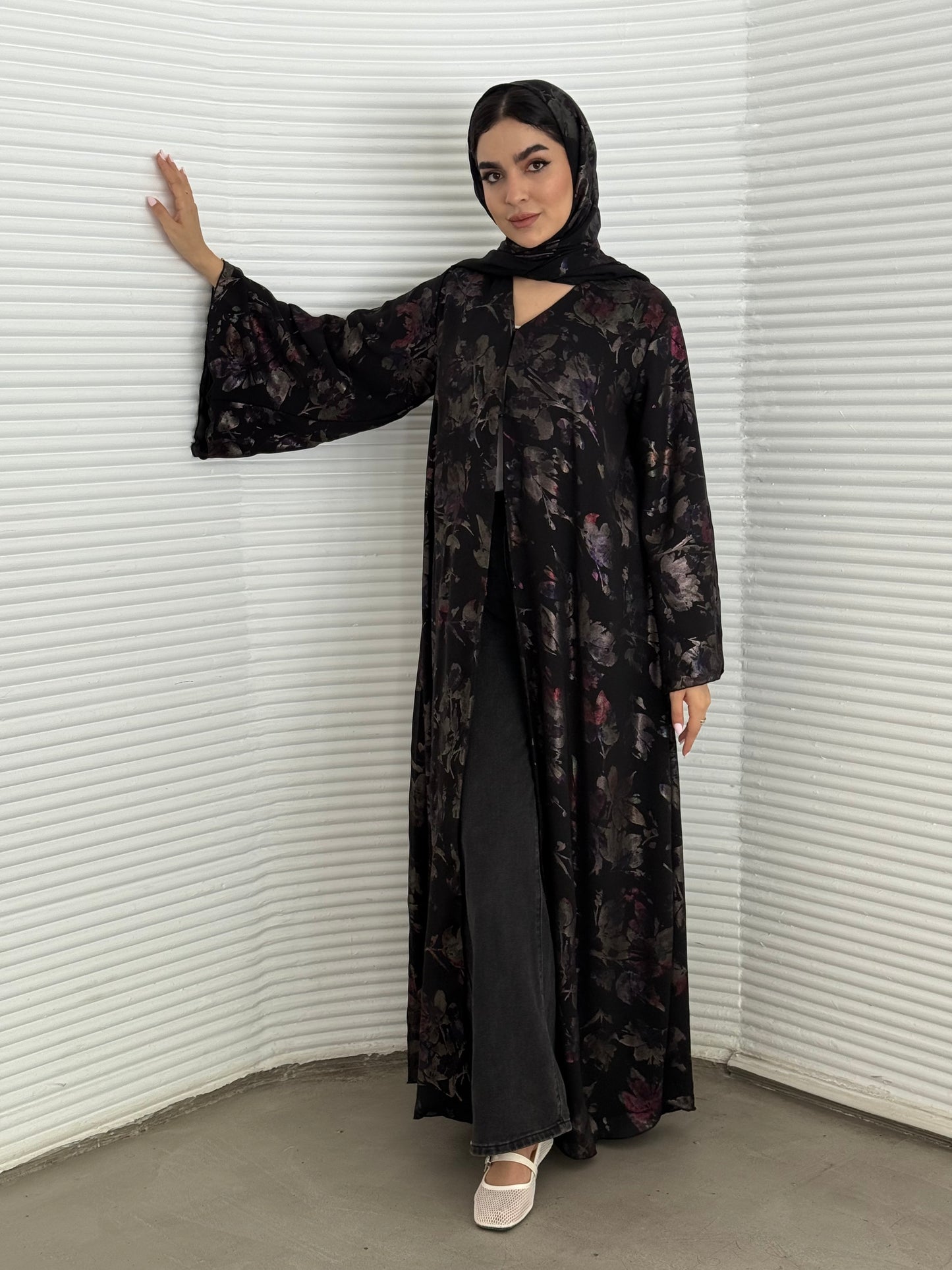 A black floral chiffon abaya, an elegant abaya that is perfect for summer, evening wear.