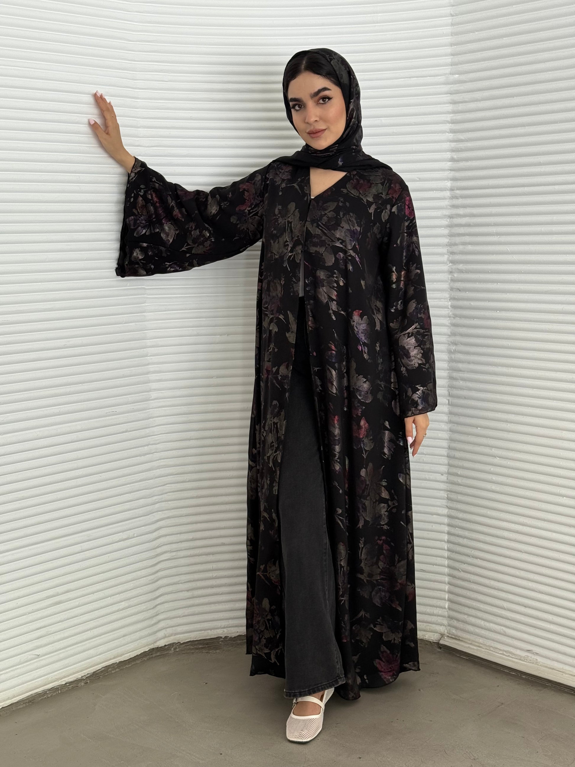 A black floral chiffon abaya, an elegant abaya that is perfect for summer, evening wear.