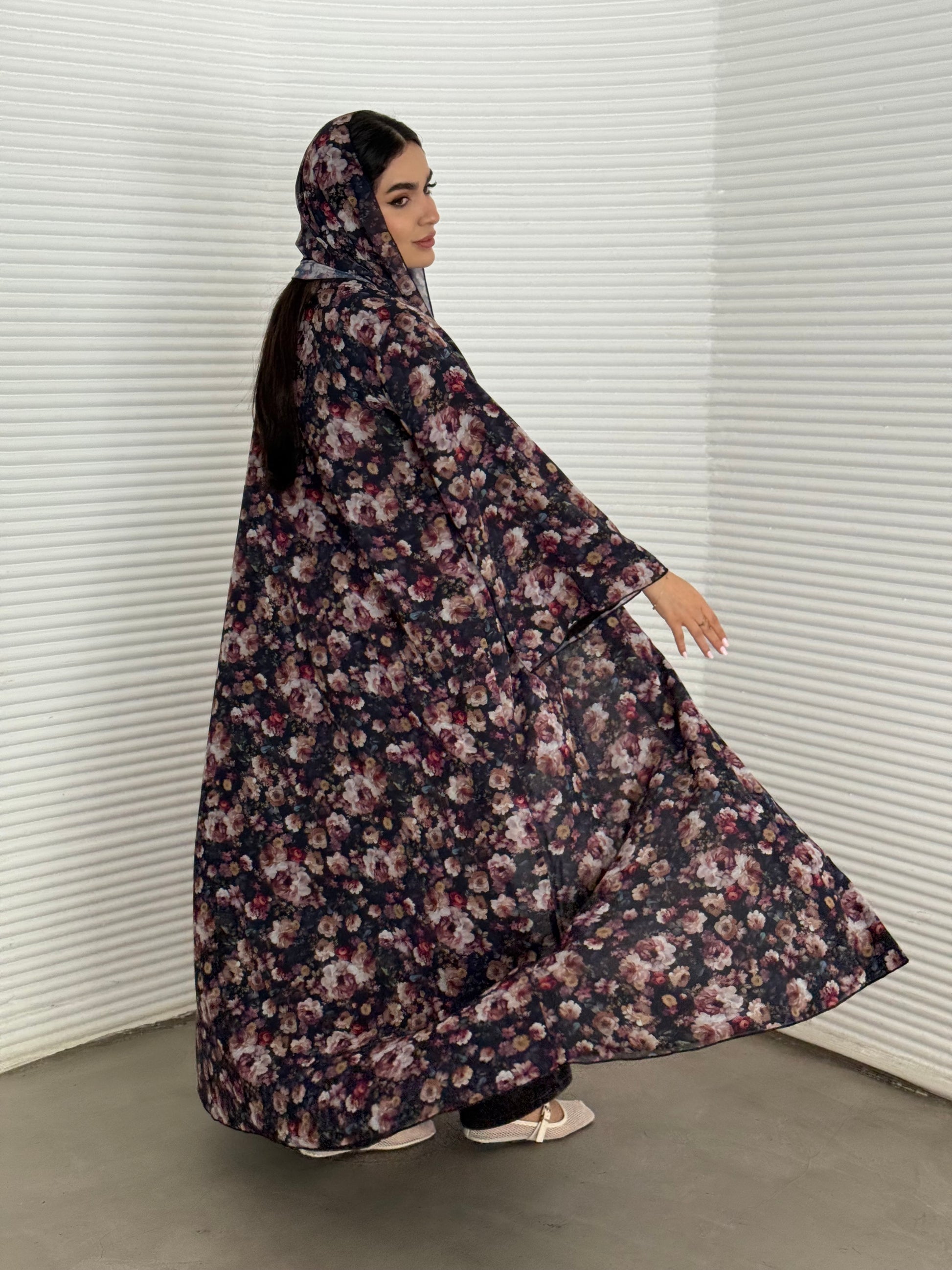 A deep dark blue floral chiffon abaya, an elegant abaya that is perfect for summer, daytime events, and brunch.