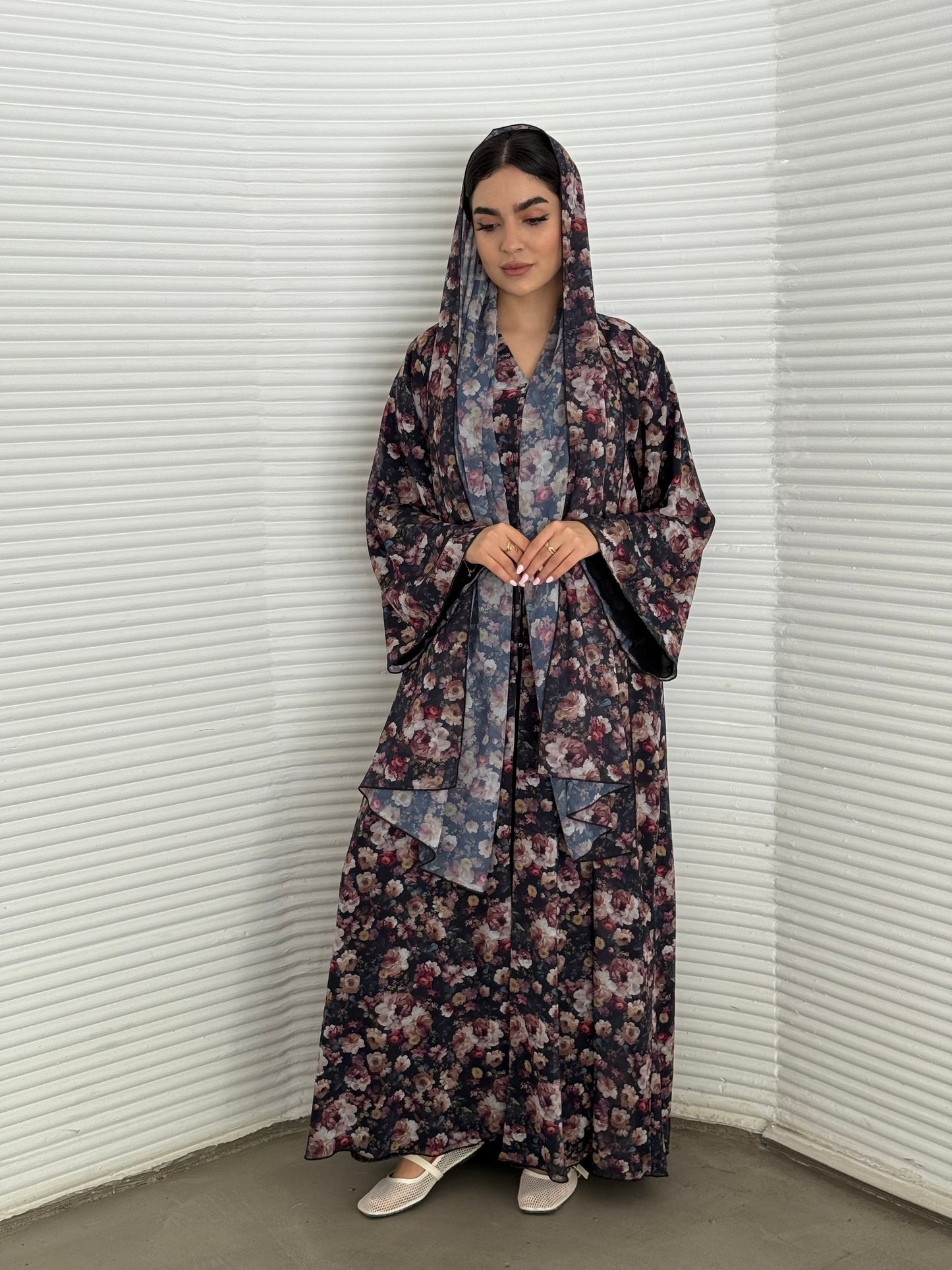 A deep dark blue floral chiffon abaya, an elegant abaya that is perfect for summer, daytime events, and brunch.