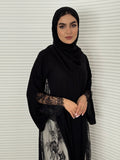 Classic black abaya with smooth crepe and sheer lace. Making it an exquisite choice for evening wear.