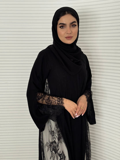 Classic black abaya with smooth crepe and sheer lace. Making it an exquisite choice for evening wear.