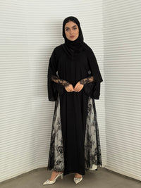 Classic black abaya with smooth crepe and sheer lace. Making it an exquisite choice for evening wear.
