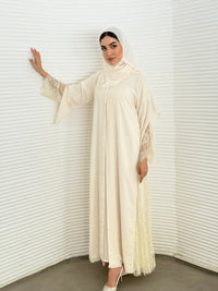 Classic cream abaya with smooth crepe and sheer lace. Making it an exquisite choice for Eid, Weddings and morning formal events.