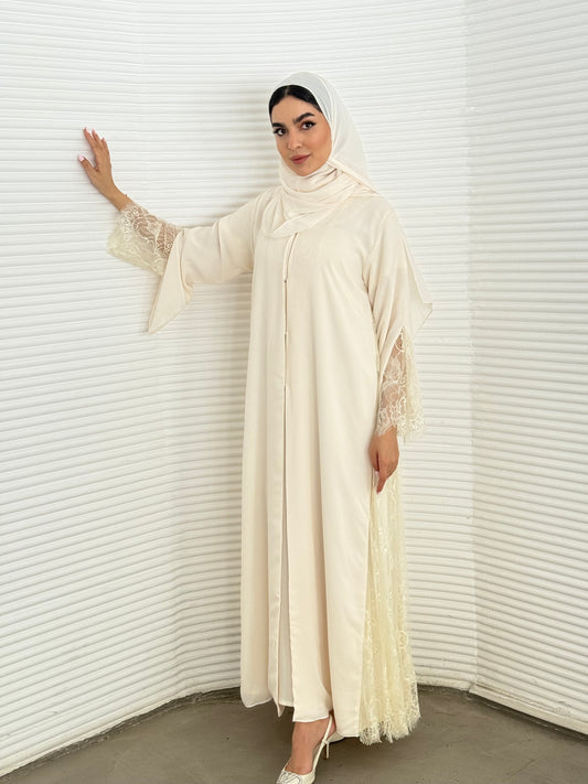 Classic cream abaya with smooth crepe and sheer lace. Making it an exquisite choice for Eid, Weddings and morning formal events.