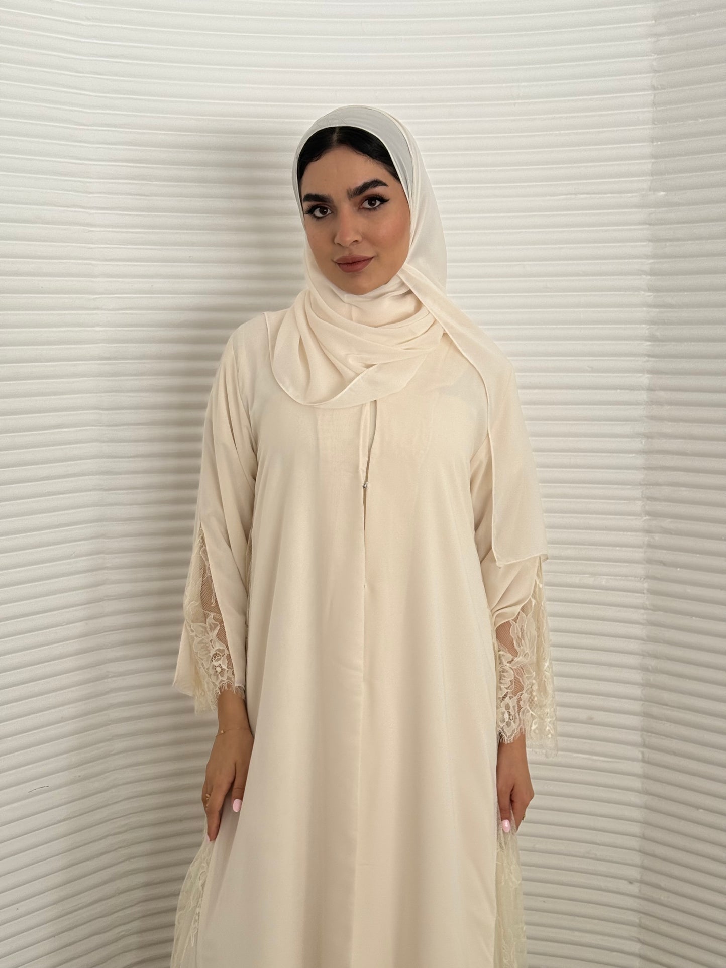 Classic cream abaya with smooth crepe and sheer lace. Making it an exquisite choice for Eid, Weddings and morning formal events.