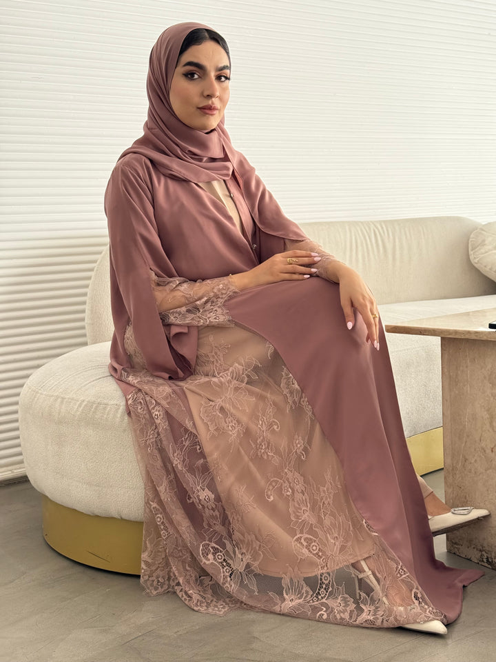 Classic dusty rose abaya with smooth crepe and sheer lace. Making it an exquisite choice for Eid, Weddings and morning formal events.
