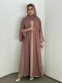 Classic dusty rose abaya with smooth crepe and sheer lace. Making it an exquisite choice for Eid, Weddings and morning formal events.