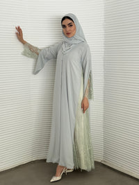 Classic Ice grey abaya with smooth crepe and sheer lace. Making it an exquisite choice for Eid, Weddings and morning formal events.