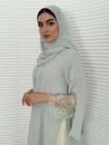 Classic ice grey abaya with smooth crepe and sheer lace. Making it an exquisite choice for Eid, Weddings and morning formal events.